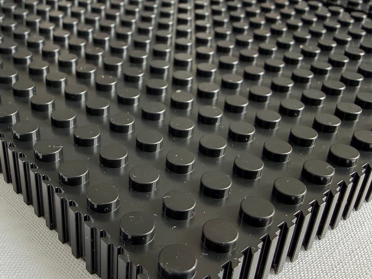 Close-up of a black studded baseplate from the kit